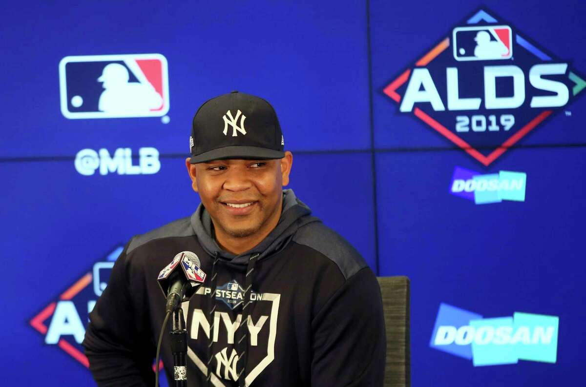 New York Yankees' Edwin Encarnacion speaks to reporters Sunday, Oct. 6, 2019, in Minneapolis as the Yankees prepare for Game 3 of the American League Division Series baseball playoffs against the Minnesota Twins. (AP Photo/Jim Mone)