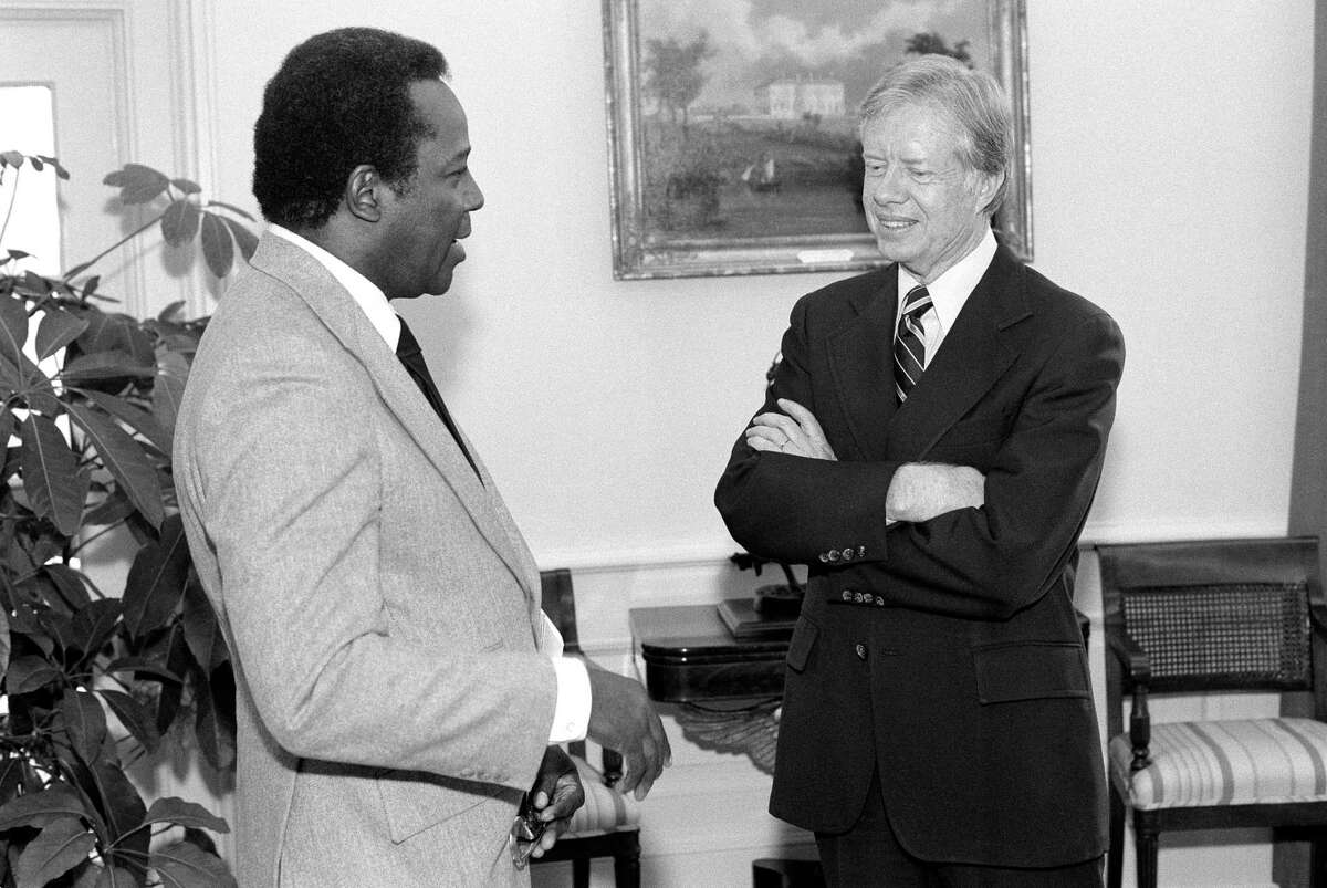 Mayor Richard Hatcher of Gary, Ind., chairman of the Conference of Black Mayors, meets with President Jimmy Carter at the White House in Washington on April 30, 1980. Hatcher, who became one of the first black mayors of a big U.S. city when he was elected in 1967, died Friday, Dec. 13, 2019. He was 86.