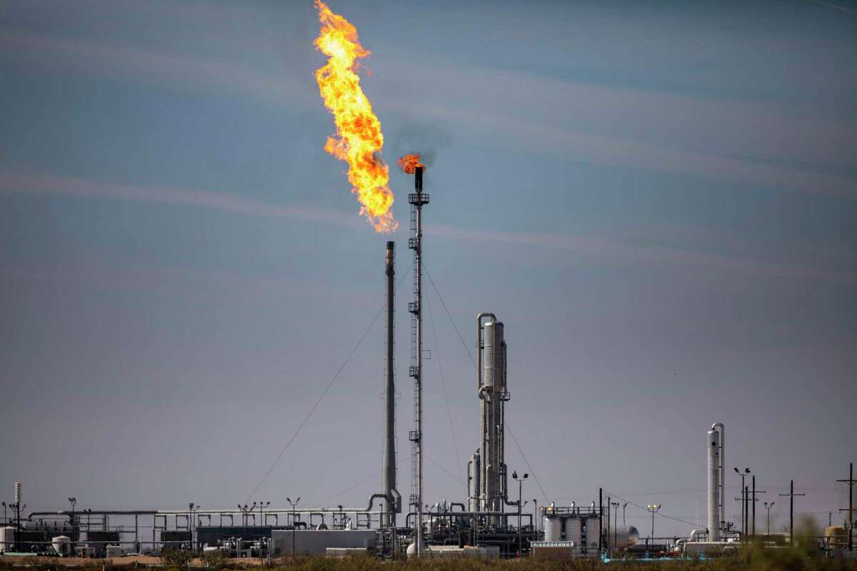A gas flare at the Targa Driver Gas Plant in the Permian Basin in Texas, Nov. 5, 2019. Immense amounts of methane are escaping from oil and gas sites nationwide, worsening global warming, even as the Trump administration weakens restrictions on offenders. (Jonah M. Kessel/The New York Times)