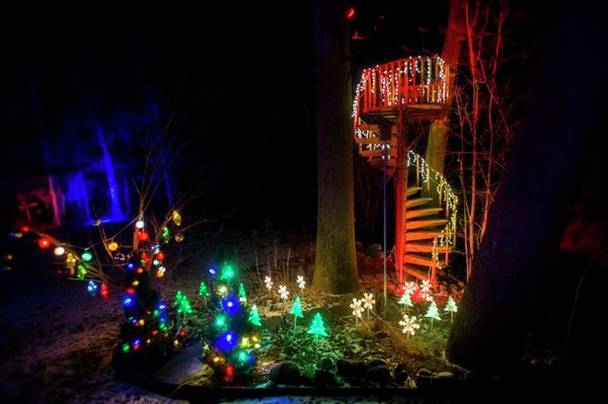 The home and front yard of Jeff and Sherry Rogers is illuminated by a spectacular lights display Friday, Dec. 20, 2019. (Katy Kildee/kkildee@mdn.net)