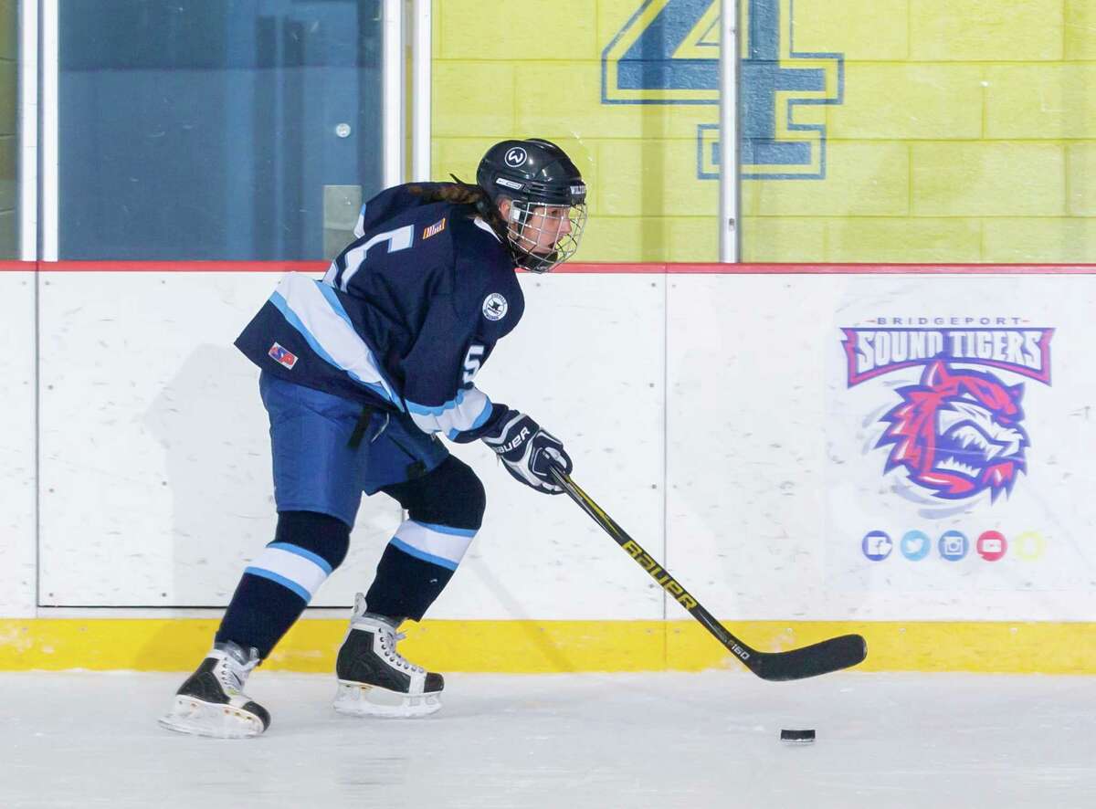 Caitlyn Hocker had four points as the Wilton-Norwalk-McMahon girls hockey team got its first win of the season on Saturday.