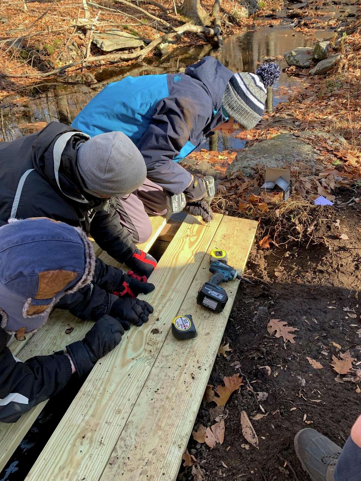 Scouts work on the bridge deck.