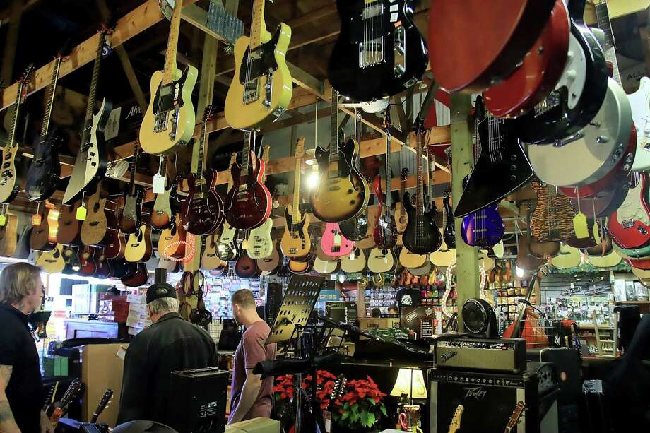 Musical instruments and equipment fill every space on the floor and the rafters at the Music Factory in Pearland. 