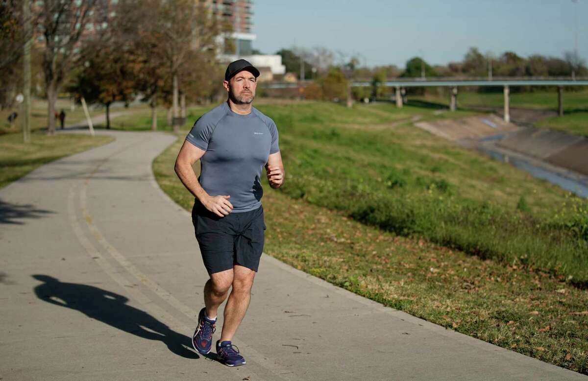 Sam Keen is shown in Stude Park Thursday, Dec. 19, 2019, in Houston. He weighed nearly 400 pounds when Hurricane Harvey hit. He spent nine days stuck in his apartment during the flood and realized it was time for a change. He is now down 200 pounds, ran two half marathons and is now training for a full marathon this February.