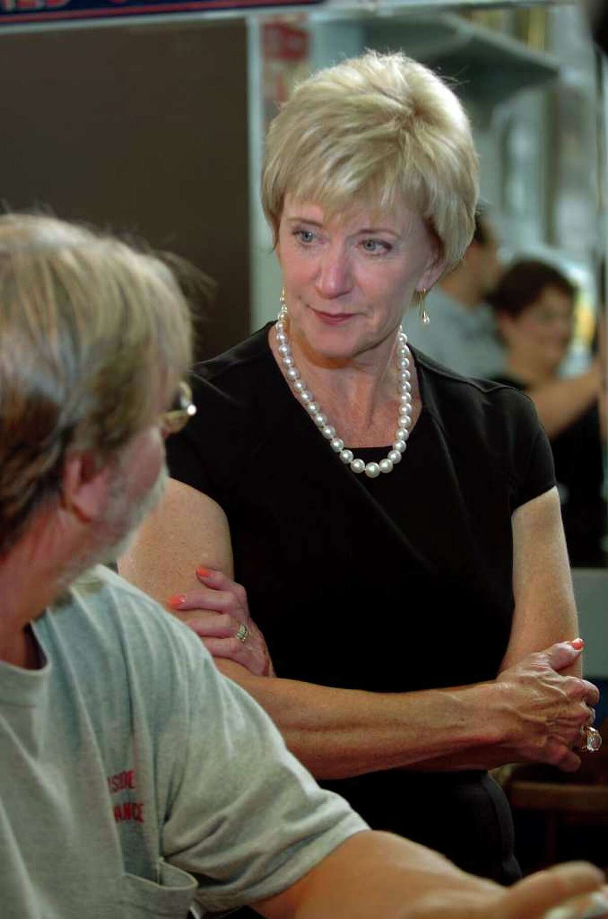 Republican senatorial candidate Linda McMahon spent some time touring small businesses in North Haven, Conn. on Wednesday August 11, 2010. Here, McMahon listens to the concerns of customer Michael Martindale, of Hamden, as he has breakfast at Scotty the Omelet King restaurant along Broadway in the town.