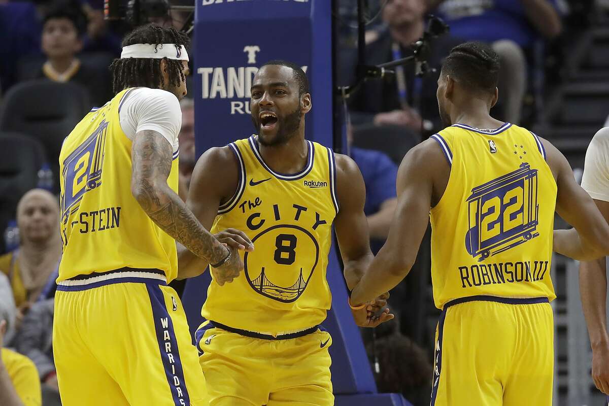 Golden State Warriors guard Alec Burks (8) is congratulated by center Willie Cauley-Stein (2) and forward Glenn Robinson III (22) after scoring against the Phoenix Suns during the second half of an NBA basketball game in San Francisco, Friday, Dec. 27, 2019. (AP Photo/Jeff Chiu)