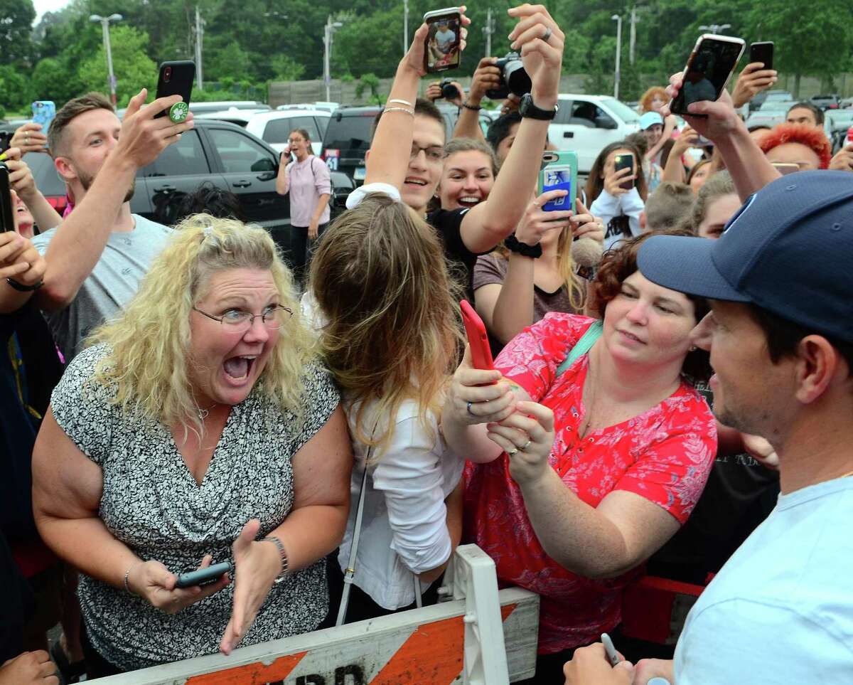 Fan Kimberly Buswell, of Ledyard, lets out a scream as she gets to see actor Mark Wahlberg as he visits his restaurant Wahlburgers and greets fans at the Westfield Mall in Trumbull on Jun. 20. Wahlburgers franchises its restaurants to independent operators, collecting 6 percent royalties on receipts and a $40,000 franchise fee for each location. Mark and Donnie Wahlberg have supported franchisees with guest appearances, both by video feed and in person including in the summer of 2019 when Mark Wahlberg drew a large crowd during an appearance at Westfield Trumbull. Like other malls nationally, Westfield Trumbull has been looking to broaden its appeal by adding leisure and entertainment options outside traditional mall retail, to include a SeaQuest aquarium and L.A. Fitness. The company is seeking town permission to build apartments on the property.