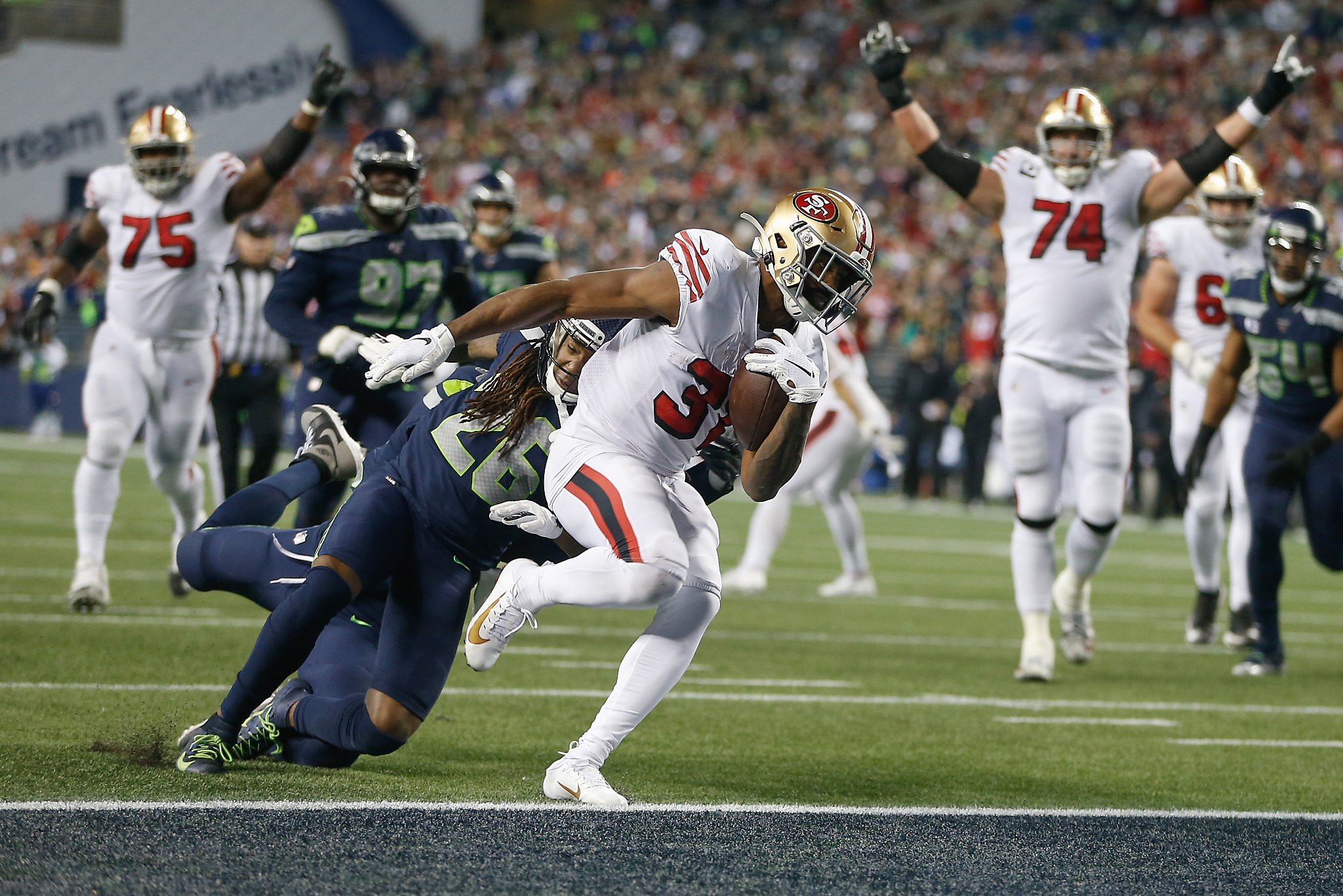 DK Metcalf of the Seattle Seahawks catches the ball over Shaquill News  Photo - Getty Images