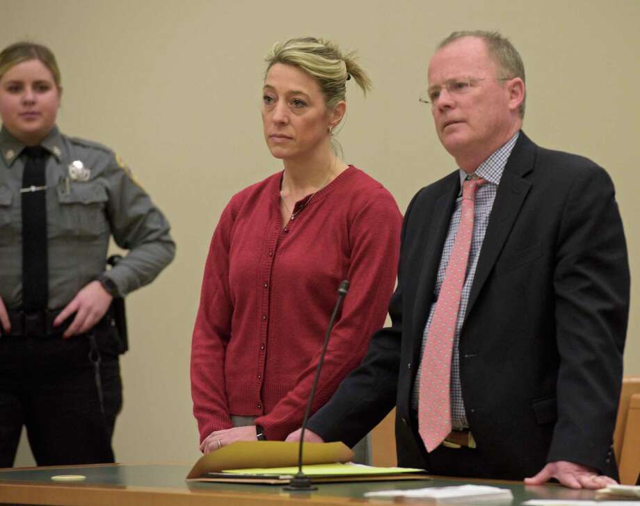 Kris Szabo, left, of Southbury, appears in Waterbury Superior Court with attorney John McDonald, on Wednesday, December 11, 2019, in Waterbury, Conn. Photo: H John Voorhees III / Hearst Connecticut Media / The News-Times