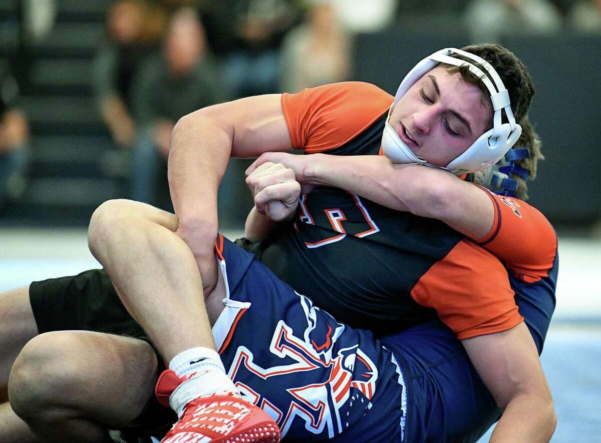Shelton's Mike Monaco works toward winning a decision versus New Fairfield.