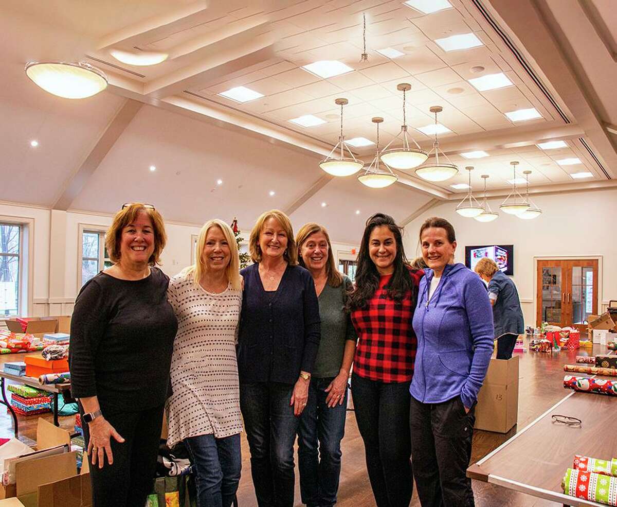 Ridgefield Thrift Shop board member Mary Coleman, center, stands with committee members from the Evelyn C. Peeler Children’s Holiday Gift Fund. From left to right: Sue Ferguson, Denise Brown, Kristi Vaughn, Gigi Bazarian and Joann Mulvaney.