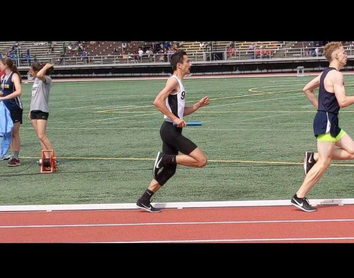 Samuel Kocurek running in the 4x800 at the outdoor track LL conference meet when a member of the Shelton High squad.