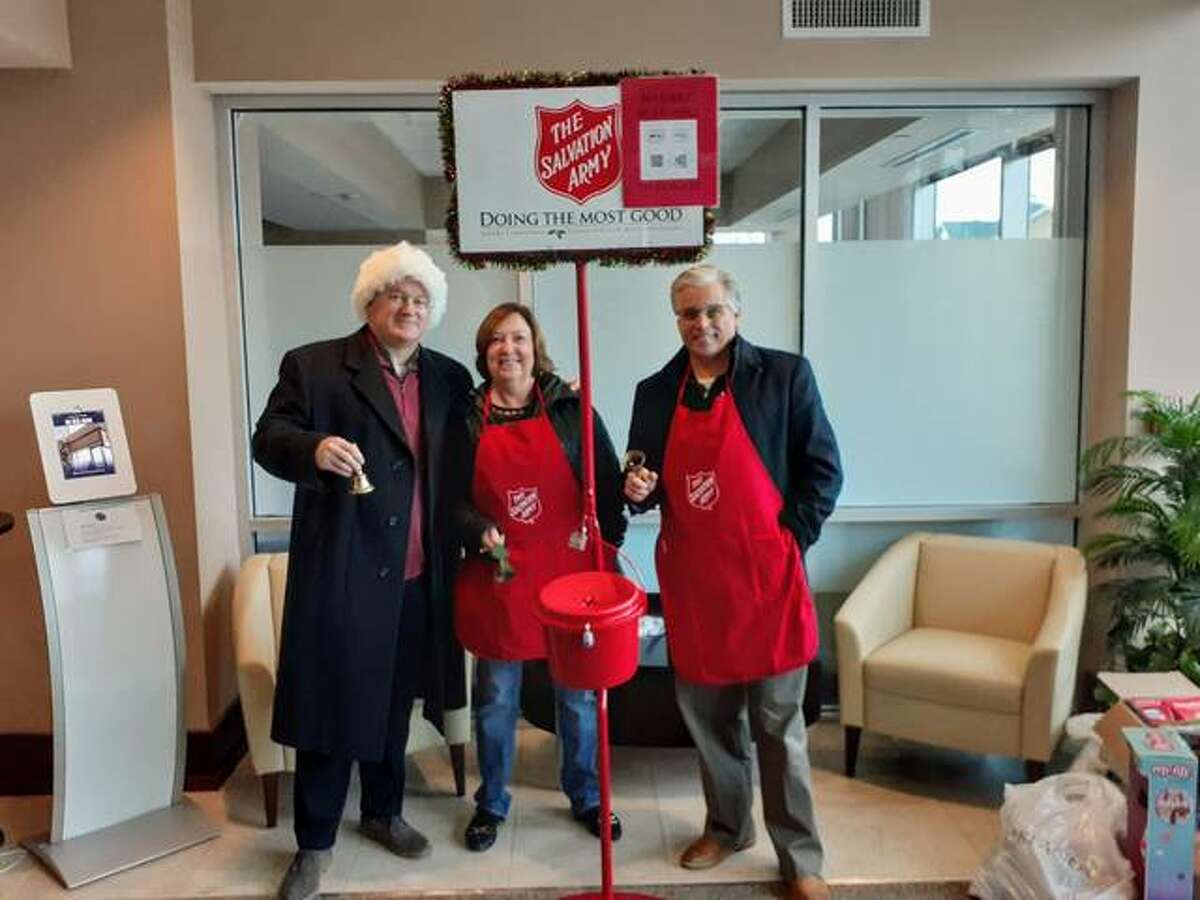 State Rep. Monica Bristow, D-Alton, center, is joined by John Simmons and Alton Mayor Brant Walker in bell-ringing this holiday season for the Salvation Army.