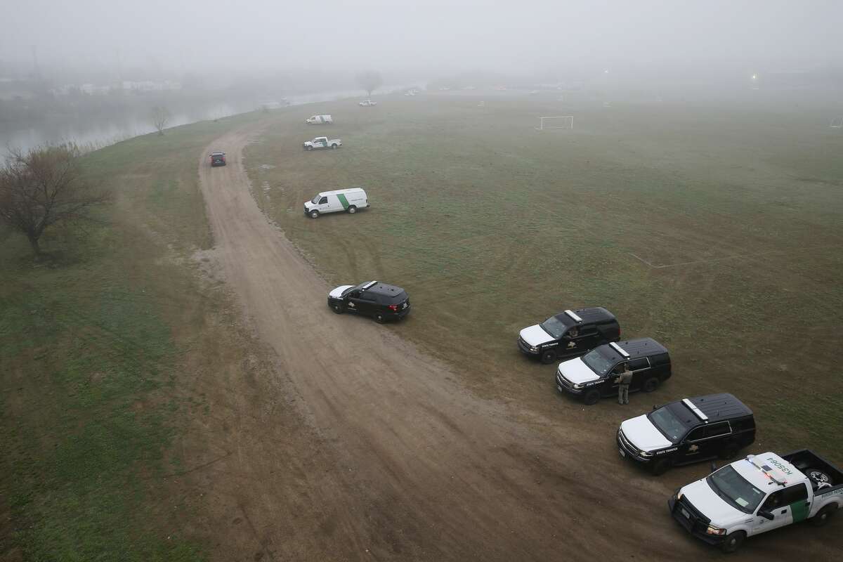 U.S. Border Patrol and Texas Department of Public Safety personnel guard the banks of the Rio Grande in Eagle Pass, Texas, Wednesday, Feb. 6, 2019. Law enforcement agencies from local to national level are on high alert after a caravan of around 1,800 Central American immigrants arrived at a shelter in Piedras Negras, Mexico across the Rio Grande from Eagle Pass on Monday.