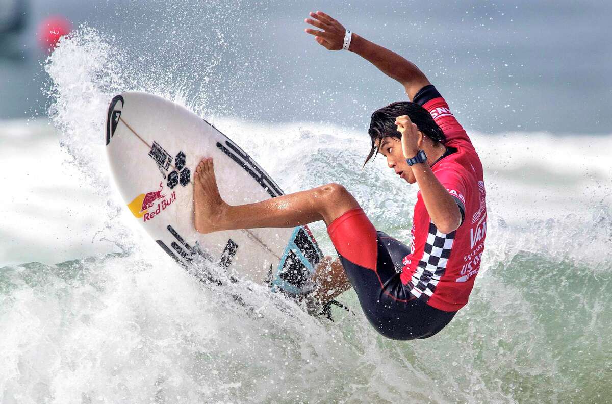 File-This Aug. 4, 2017, file photo shows Kanoa Igarashi, of Huntington Beach, Calif., surfing in his heat at the U.S. Open of Surfing in Huntington Beach, Calif. His father grew up surfing in Japan before moving to Huntington Beach, to be in the heart of surf country. The 22-year-old Igarashi has dual citizenship and elected to compete for Japan where's already a household name and been featured in a reality TV show. (Mark Rightmire/The Orange County Register via AP)