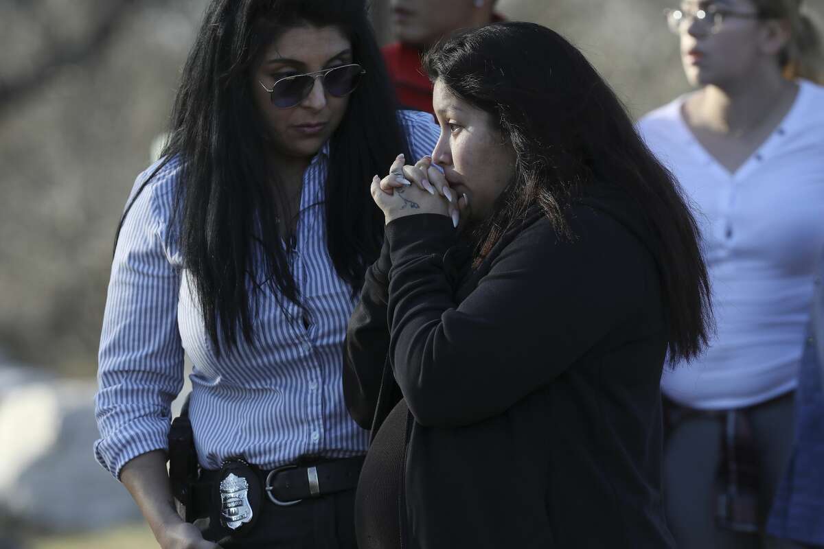 Jasmine Gonzales, mother of missing eight-month-old King Jay Davila, talks with a San Antonio Police investigator by an area along Leon Creek by Rodriguez County Park, Sunday, Jan. 6, 2018. The child went missing after being abducted from a nearby convenient store on Friday. A group of family and friends searching the area found a baby bottle that she said belong to her son. Soon after taking with the investigator, Gonzales left the scene.