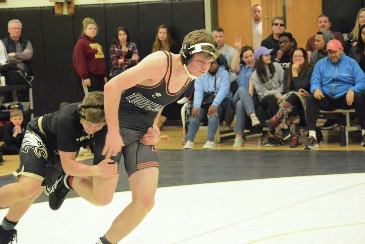 Stefan Sigurdsson (shown last season) and the Ridgefield wrestling team won a dual meet and then finished eighth at a holiday tournament.