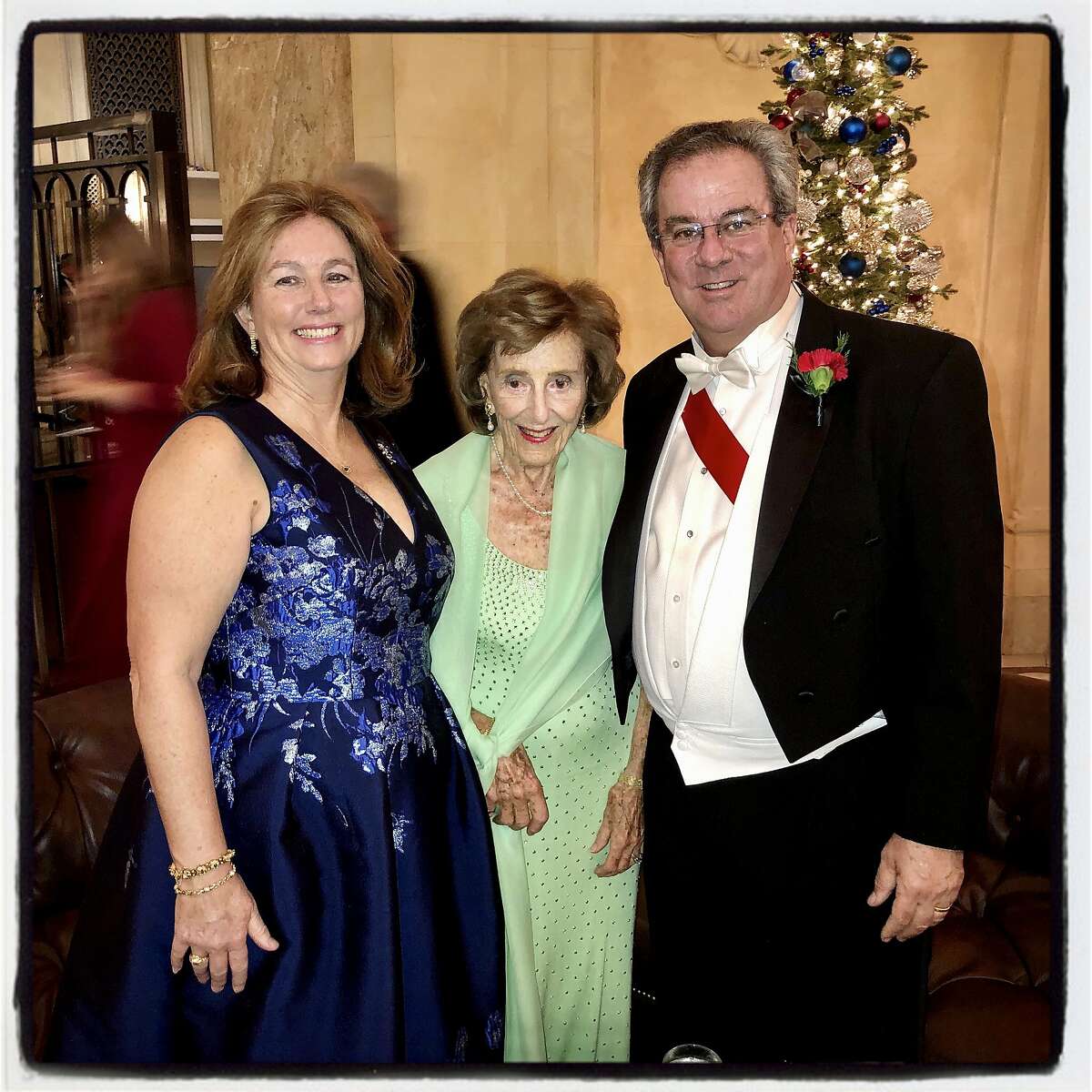 Former debutante Anne Giannini McWilliams (center) with her daughter-in-law and son, Sheila and Keith McWilliams, at the Cotillion Club Debutante Ball. Dec. 21, 2019.