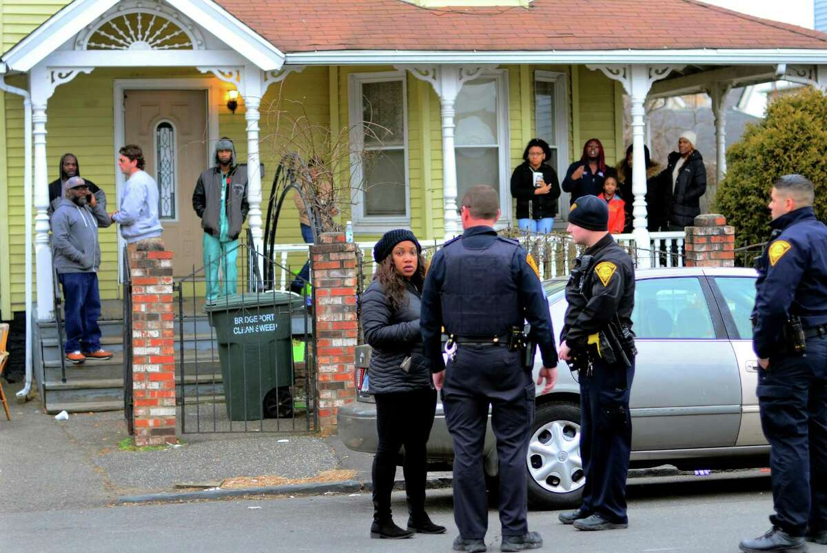 After a fatal shooting yesterday, friends and family gather at the residence on Williams Street in Bridgeport, Conn. on Thursday Feb. 6, 2019. Sujatna Lee Edwards was killed on Tuesday, Feb. 5, 2019 when bullets from a dispute outside her home went through her second-floor window.