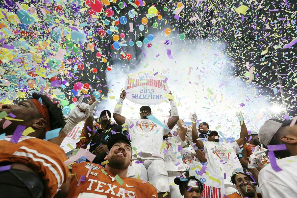The Texas Longhorns celebrate with confetti and balloons as they defeat the Utah Utes at the 2019 Valero Alamo Bowl at the Alamodome on Tuesday, Dec. 31, 2019. The Longhorns defeated the Utes, 38-10, to win the 2019 Valero Alamo Bowl.