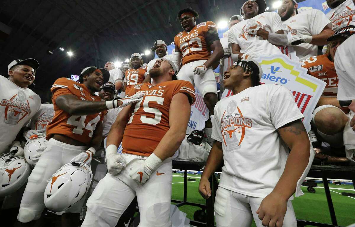 Texas Longhorns' Junior Angilau (75) performs a chant as players join in after the Longhorns defeat the Utah Utes in the 2019 Valero Alamo Bowl at the Alamodome on Tuesday, Dec. 31, 2019. The Longhorns defeated the Utes, 38-10, to win the 2019 Valero Alamo Bowl.