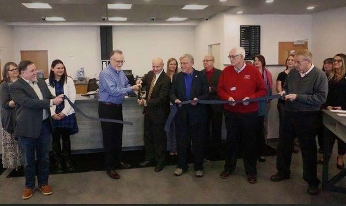 West Michigan Credit Union board members and employees participate in a ribbon cutting to celebrate the opening of the new location at 4795 220th Avenue in Reed City. The facility is now open and the former location in Vicâ€™s shopping center is closed. (Submitted photo)