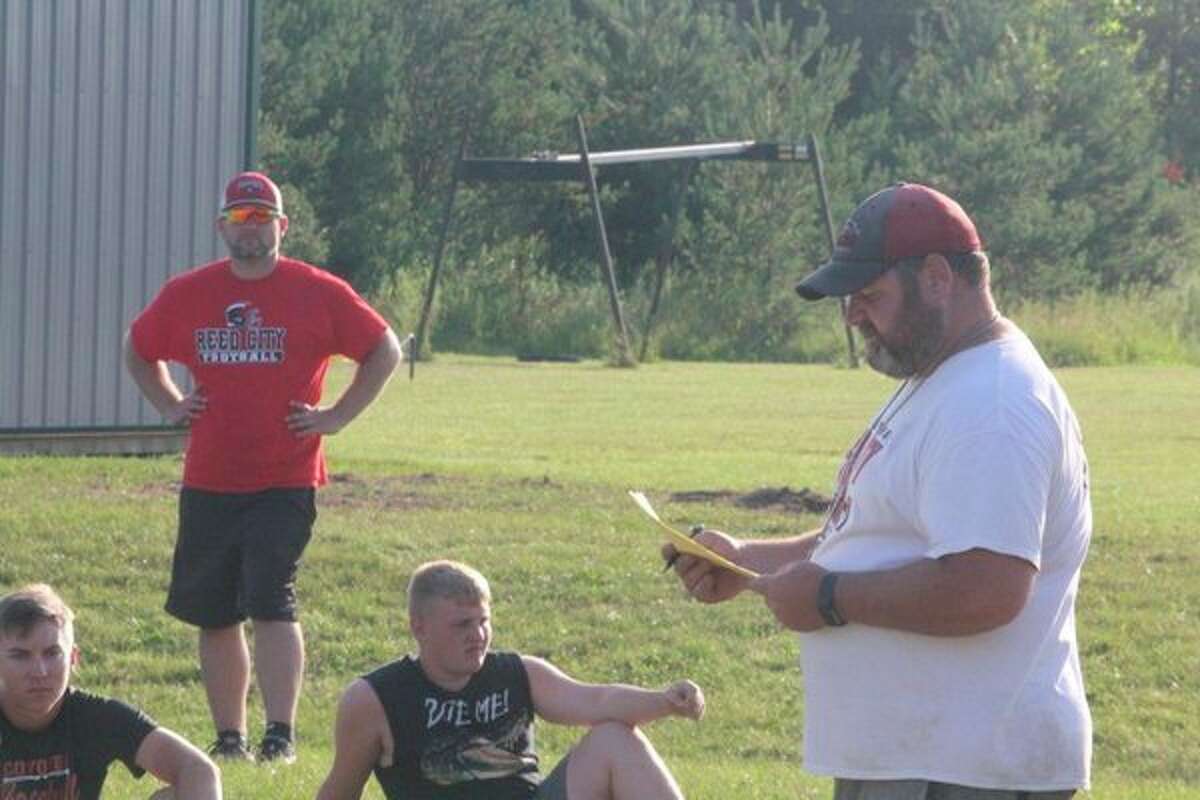 Scott Shankel (right) took over as Reed City football coach this season. (Herald Review file photo)