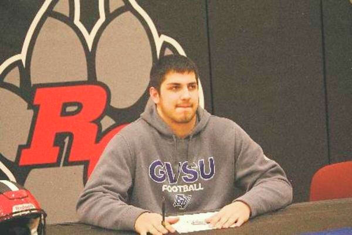 Anthony Pelton is pictured here on signing day when he formally committed last February to Grand Valley football. (Herald Review file photo)