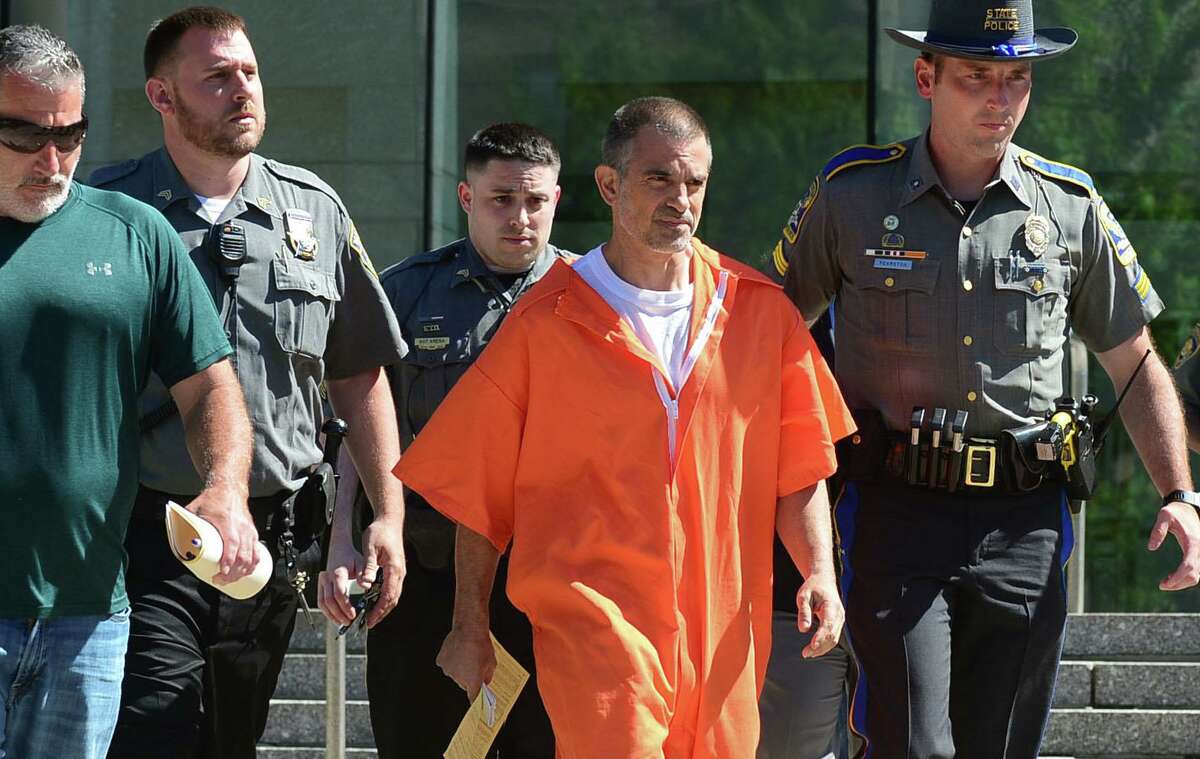 Fotis Dulos exits Stamford Superior Court on June 11 with bondsman, state police and judicial marshals after posting $500,000 bond for charges of tampering with evidence and hindering the investigation into the disappearance of his wife, Jennifer Dulos.