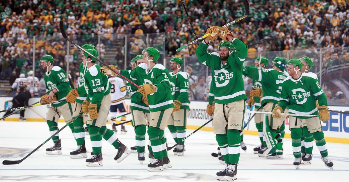 DALLAS, TEXAS - JANUARY 01: The Dallas Stars celebrate a 4-2 win over the Nashville Predators at the Cotton Bowl on January 01, 2020 in Dallas, Texas. (Photo by Richard Rodriguez/Getty Images)