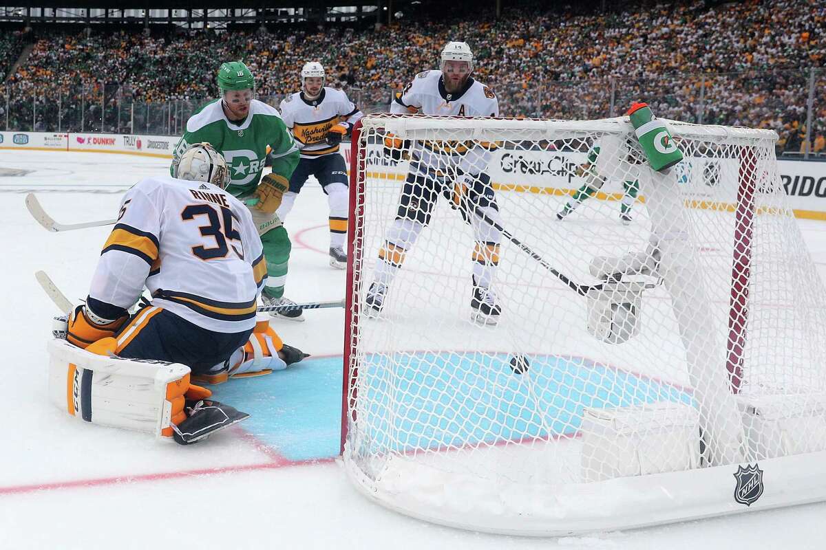 DALLAS, TEXAS - JANUARY 01: Joe Pavelski #16 of the Dallas Stars watches the puck shot by Alexander Radulov get past Pekka Rinne #35 of the Nashville Predatorsat the Cotton Bowl on January 01, 2020 in Dallas, Texas. (Photo by Richard Rodriguez/Getty Images)