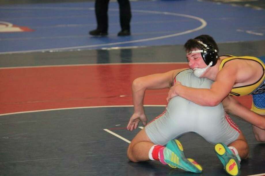 Evart's Reese Ransom (right) works against his opponent at the Chippewa Hills Invitational. (Pioneer photo/John Raffel)