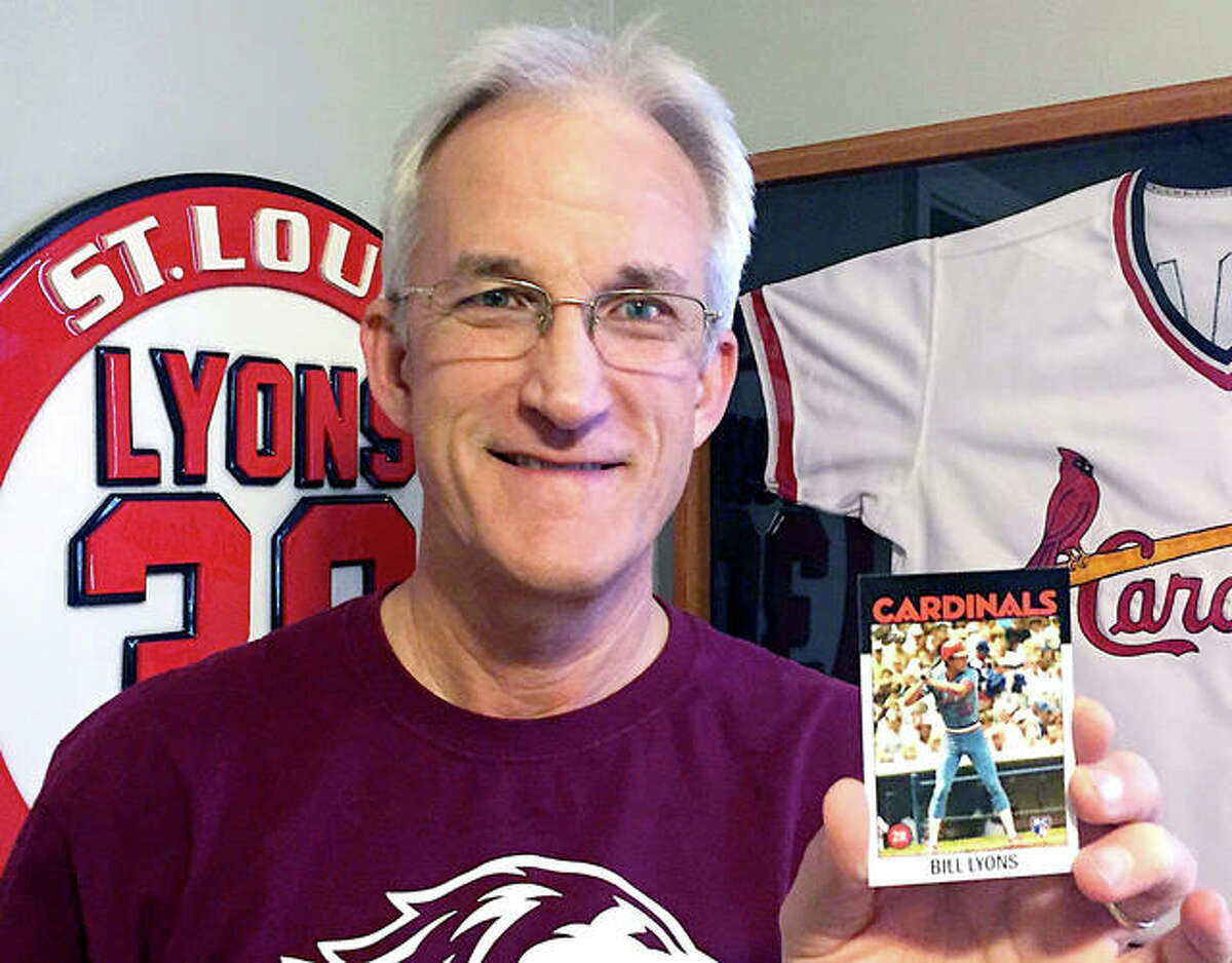 Alton native Bill Lyons with his Cardinals Topps baseball card which was given to him as a Christmas gift by his family. Lyons, an Alton High and SIU Carbondale grad, played half of the 1983 and 1984 seasons with the Cardinals, but Topps did not make a Lyons baseball card since his one-year in MLB was spread over two sesons. Lyons’ family consulted Topps and had the card made for him. Lyons lives in Heyworth, Illinois.