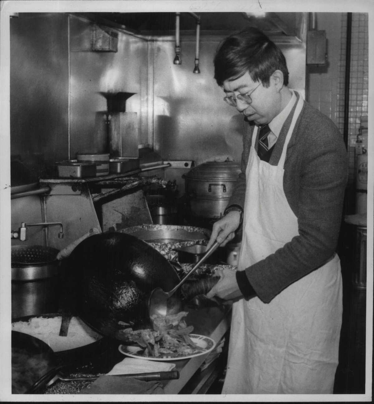 Hunan Restaurant, Albany, New York - Charles M. Chow of Albany, owner, making "Chef's Special" bean curd Undated (tofu). January 07, 1984 (Bob Richey/Times Union Archive)