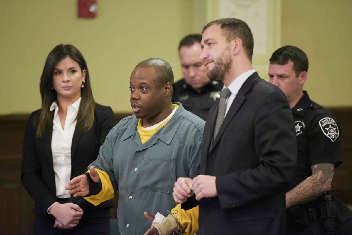 James White, left, and his attorney, Kurt Haas appear in Rensselaer County Court for a suppression hearing on Thursday, Jan. 2, 2020, in Troy, N.Y. White is charged with murder in the December 2017 killings of Brandi Mells, Shanta Myers, and Myers' children, Jeremiah Myers, and Shanise Myers. (Paul Buckowski/Times Union)