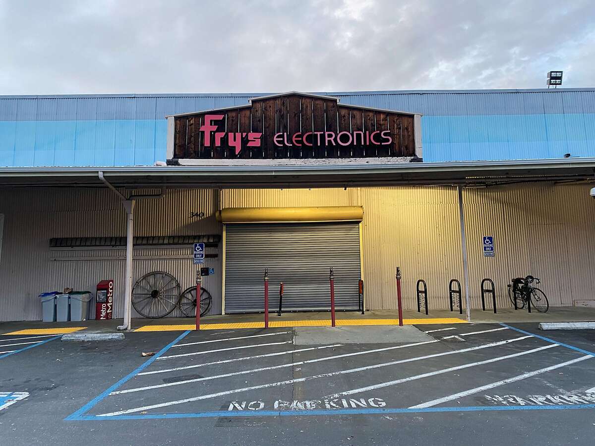 The door of the Fry's Electronics store in Palo Alto is covered on Jan. 1, 2020.