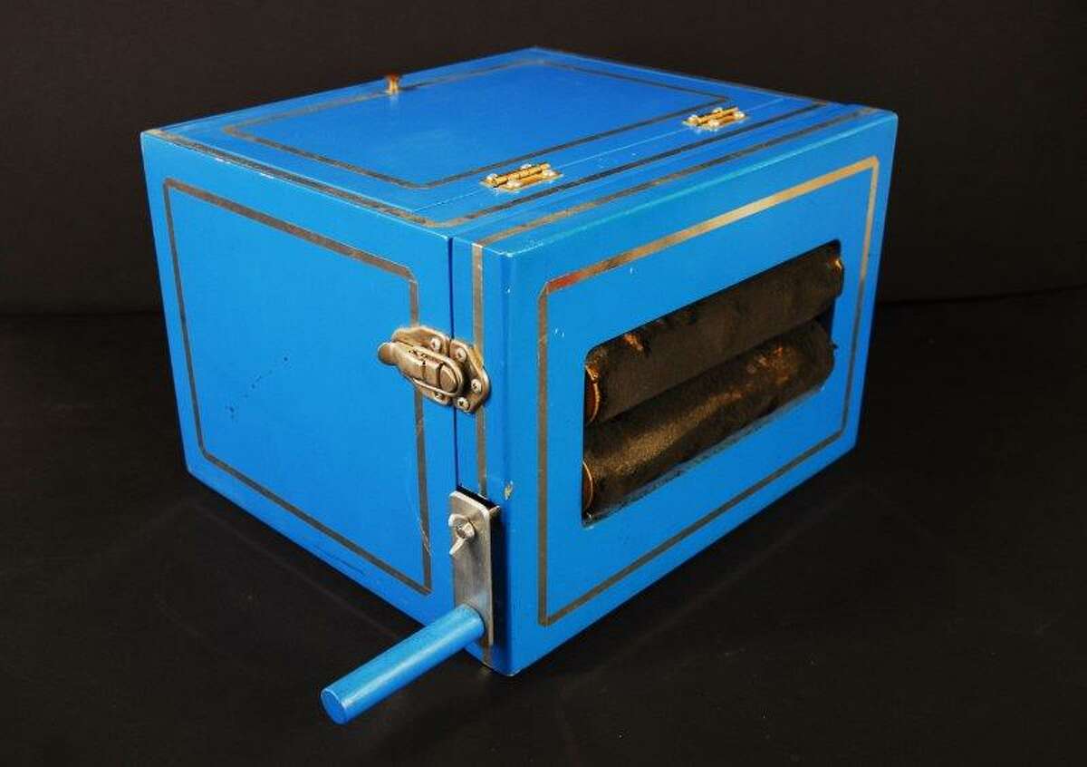 Lot 222: Rabbit Wringer Production Box, painted wood blue