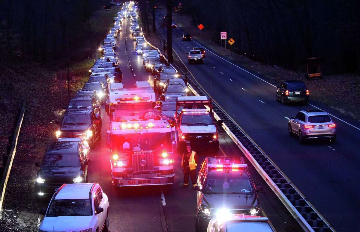 Emergency personnel including theNorwalk and Westport Fire Department firefighters respond to the scene of a five car accident on the Merritt Parkway North between exits 40 and 41 Tuesday, November 19, 2019, in Norwalk, Conn. Several persons were extracted from one of the vehicles and sent to Norwalk Hospital for evaluation.