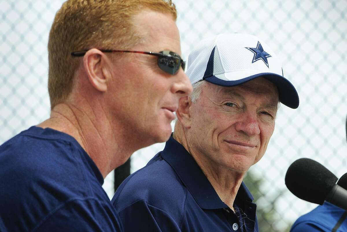 Dallas Cowboys owner Jerry Jones, right, watches as head coach Jason Garrett, left, answers a question from members of the media during the State of the Cowboys address at NFL football training camp on Saturday, July 20, 2013, in Oxnard, Calif. (AP Photo/Gus Ruelas)