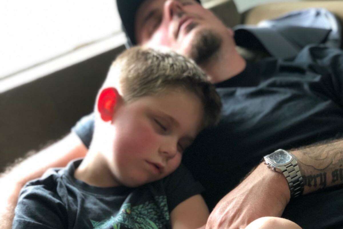 East Haven 7-year-old Trenton O'Brien and his father, Tim, get some down time at home during Trenton's continuing fight against a rare and nearly always fatal tumor.