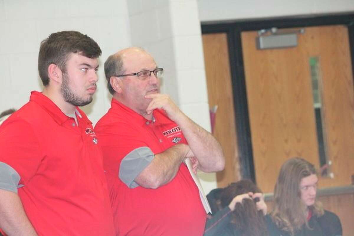 Reed City assistant wrestling coach Brett Walker (left) and head coach Roger Steig watch the action at the Big Rapids Invitational earlier this season. (Pioneer photo/John Raffel)