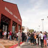 People wait to enter the new Midland County Public Library Centennial branch, which opened April 13, 2013.