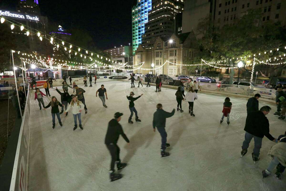 Locals and visitors pay a visit to the Rotary Club Ice Rink located in Travis Park on Friday, Jan. 3, 2020. The outdoor ice rink that opened in December has attracted young and old skaters to the unique venue. Many venture onto the ice for the first time with some experienced skaters sprinkled in the mix. For a family visiting from Laredo, the ice skating rink was a must-stop experience along with taking in a Spurs game and doing some shopping while they stayed at the downtown Sheraton. The rink will remain open until the end of January.