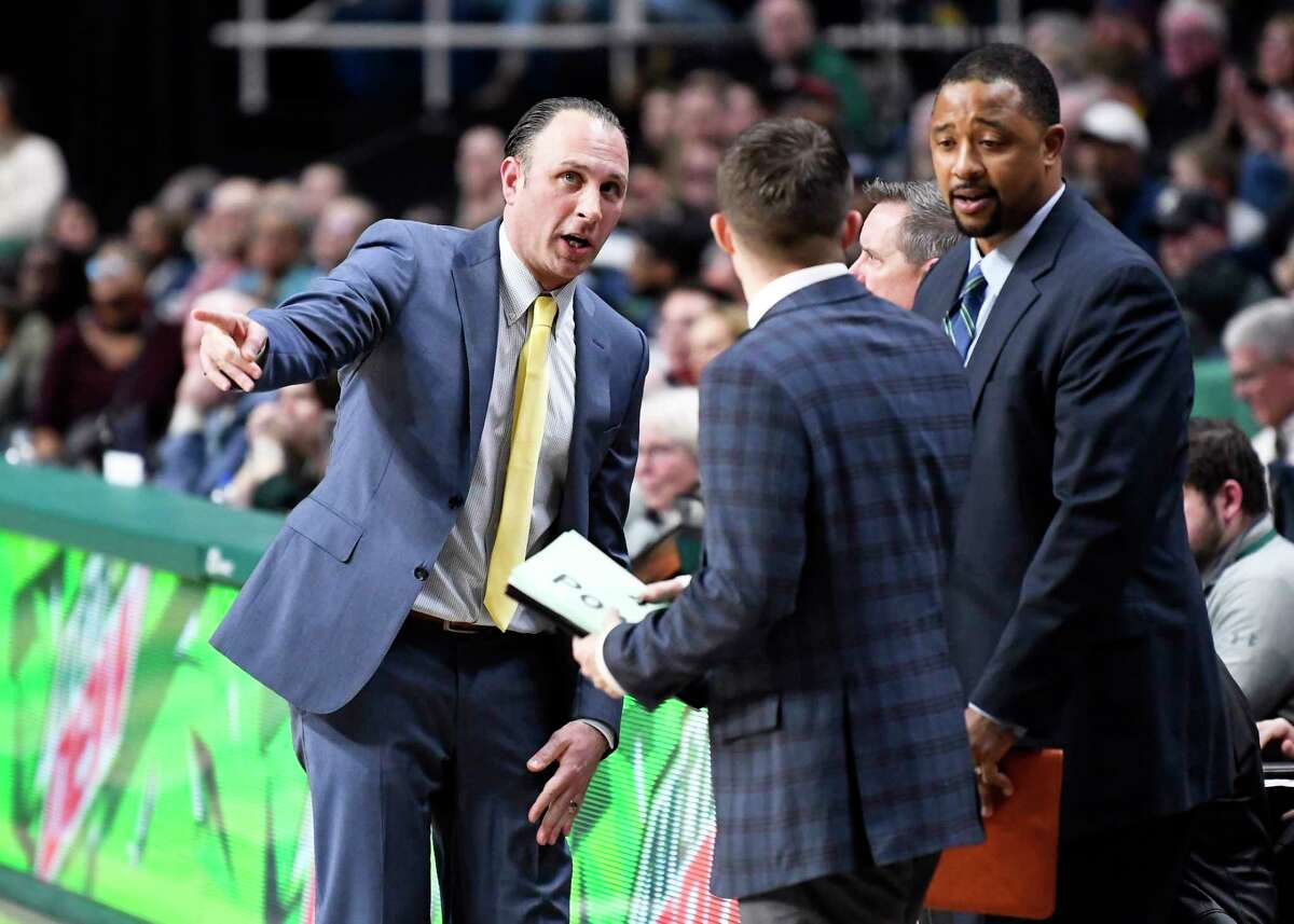 Siena head coach Carmen Maciariello ], left, talks with his coaching staff during the second half of an NCAA basketball game Friday, Jan. 3, 2020, in Albany, N.Y. Siena won 75-72. (Hans Pennink / Special to the Times Union) ORG XMIT: 010420_siena_HP111