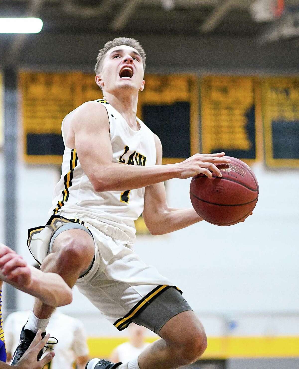 Jon Vitale hit a tie-breaking 3-pointer when Law defeated Foran, 57-52. Jonathan Law's Jon Vitale against Brookfield High at Jonathan Law high school, Thursday, December 19, 2019.