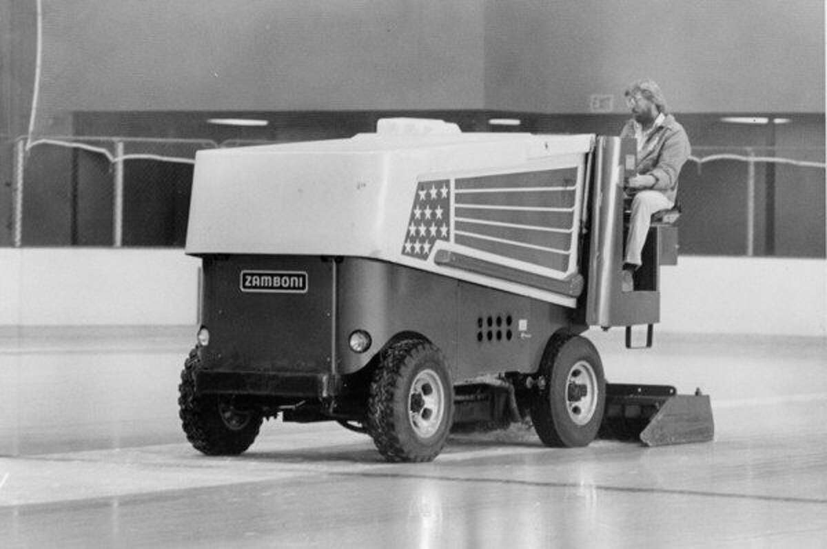 Driver Dave Howard guides the Zamboni ice resurfacer over one of the two rinks at Midland Civic Arena. November 1979