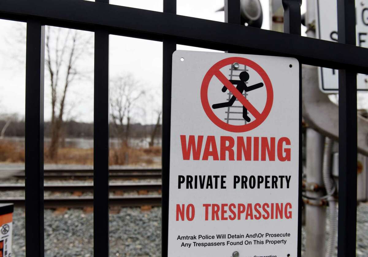 Warning signs prohibit access to an undeveloped village park next to the Hudson River on Friday, Jan. 3, 2020, in Castleton-on-Hudson, N.Y. High speed Amtrak lines run between village streets and the river. (Will Waldron/Times Union)
