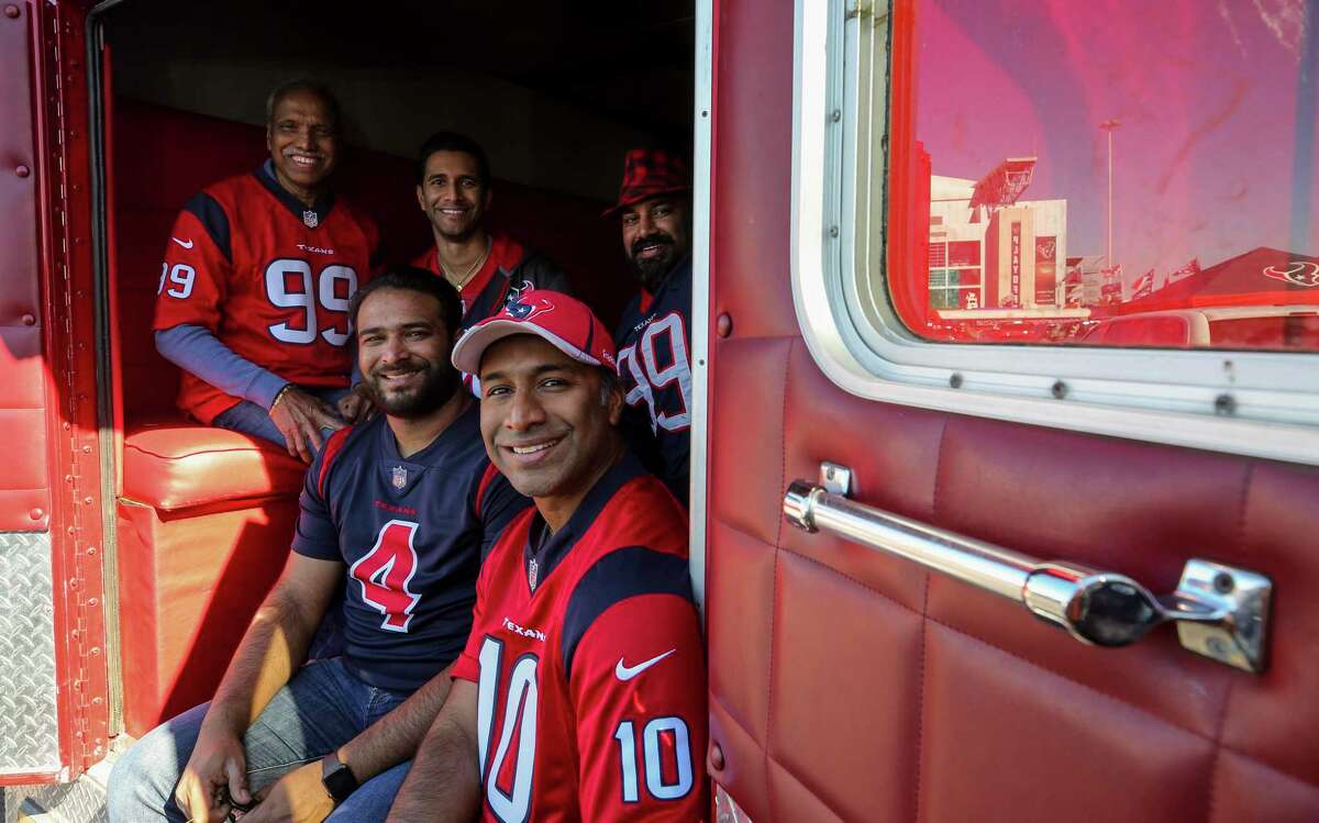 Pavan Pinnamaneni poses for a photograph with his family inside the ambulance he converted into a tailgating vehicle. Photographed before the AFC Wild Card playoff game at NRG Stadium Saturday, Jan. 4, 2020, in Houston.