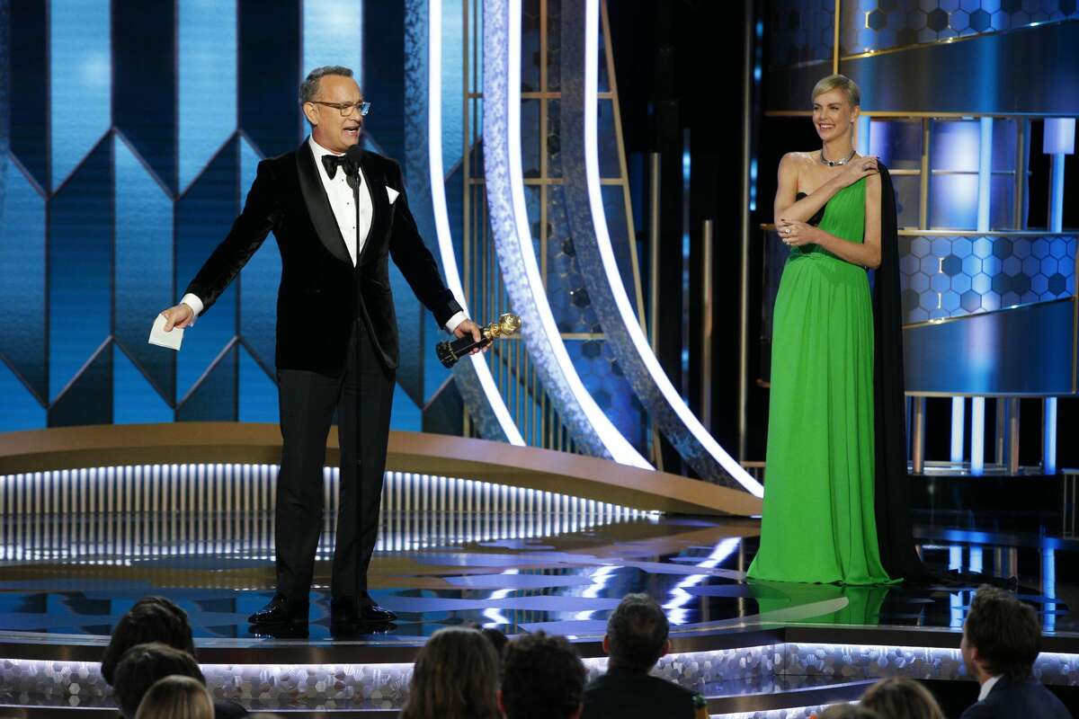 Tom Hanks accepts the CECIL B. DEMILLE AWARD, presented by Charlize Theron, onstage during the 77th Annual Golden Globe Awards at The Beverly Hilton Hotel on January 5, 2020 in Beverly Hills, California. (Photo by Paul Drinkwater/NBCUniversal Media, LLC via Getty Images)