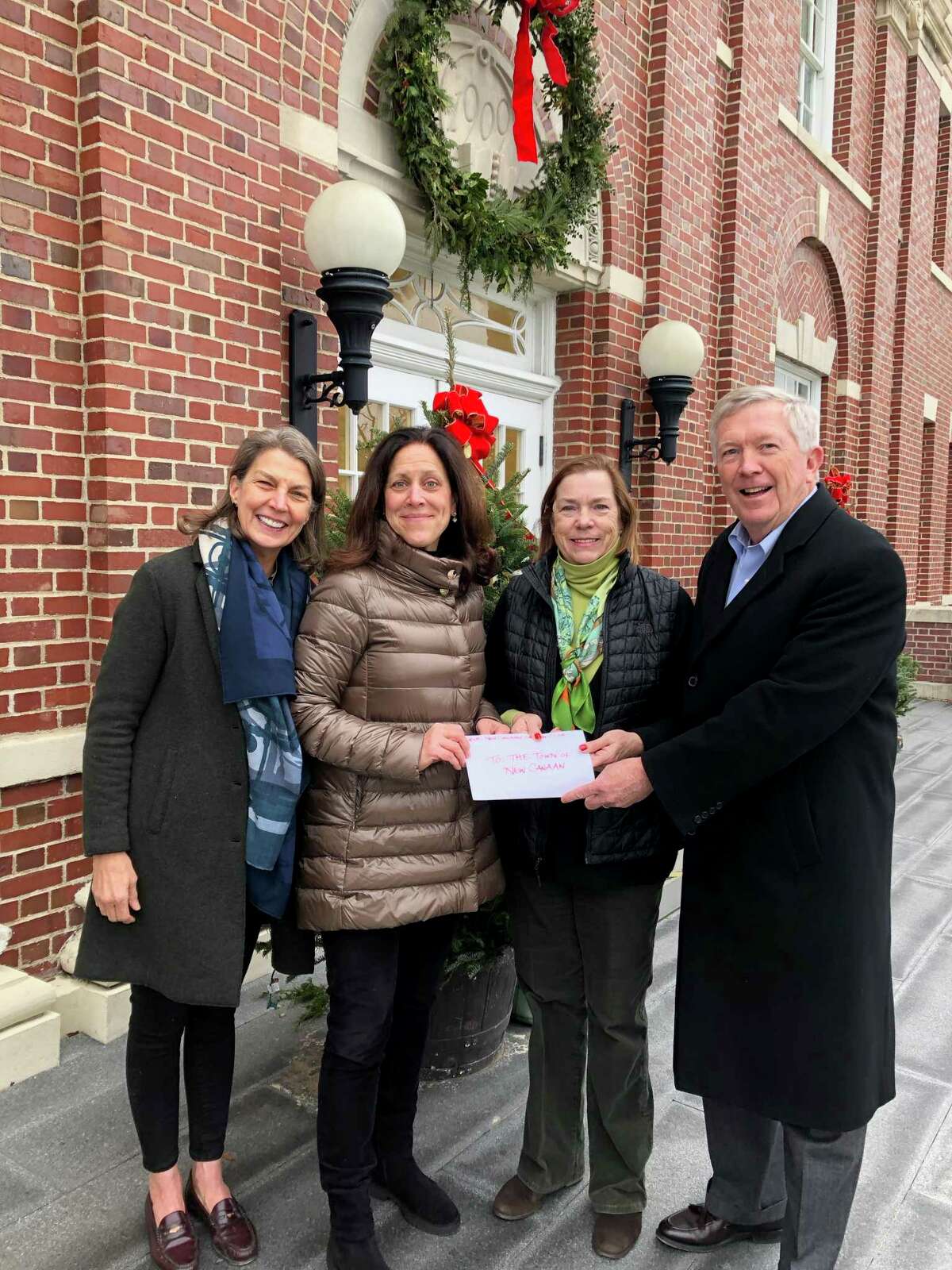 New Canaan Garden Club members recently donated more than $3,000 to the town that was earmarked for one of three organizations: The food pantry, Warm Up Fund or GetAbout. Picutred are: Bethany Zaro, Lauren Bromberg, Anda Hutchins and New Canaan First Selectmen Kevin Moynihan.